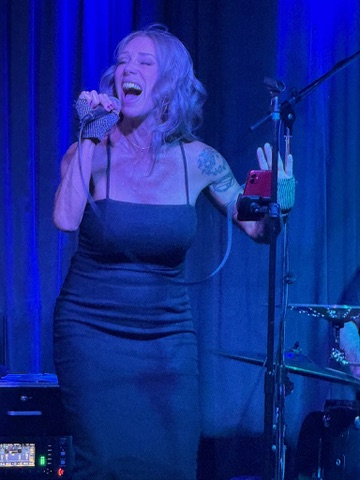 Meg, lead vocalist of GEMS, singing live in the Bay Area